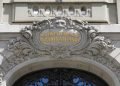 Bern, Switzerland - April 17, 2019: Above the entrance door to the building where the Swiss National Bank is located, there is a decorative inscription. Schweizerische Nationalbank